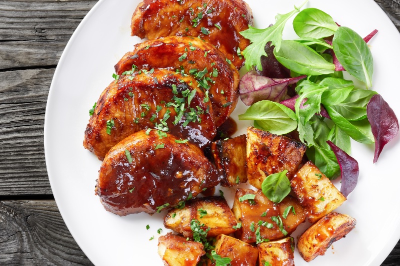 Easy Baked BBQ Pork Chops on a white plate