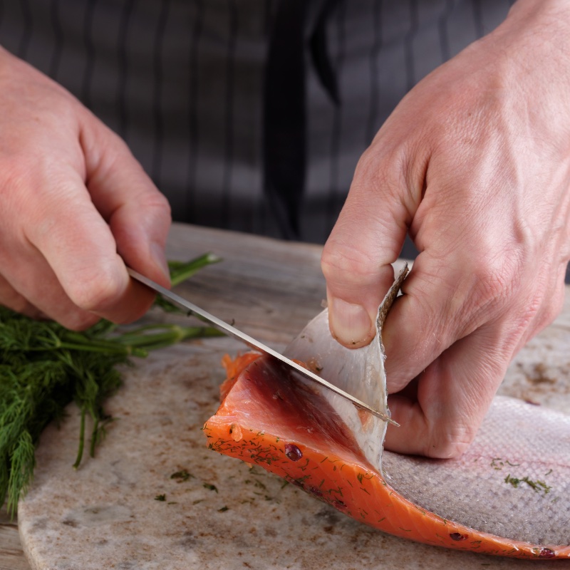 Seared Honey Ginger Salmon Bowl removing the salmon skin