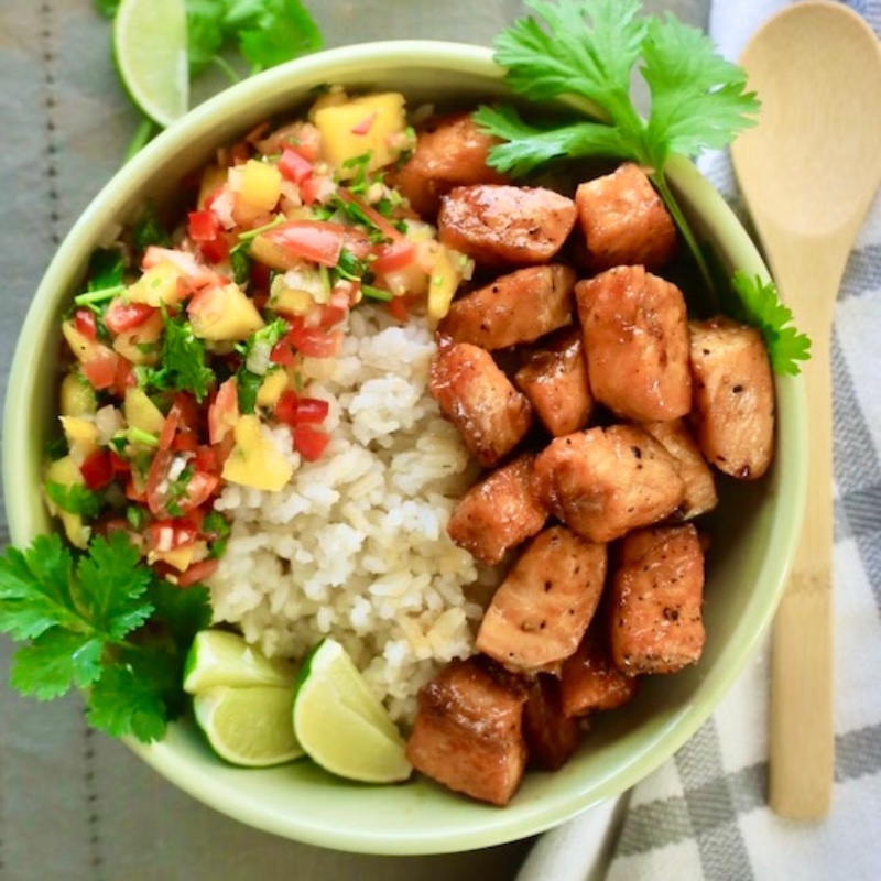 Seared Honey Ginger Salmon Bowl in a bed of rice with Mango Salsa
