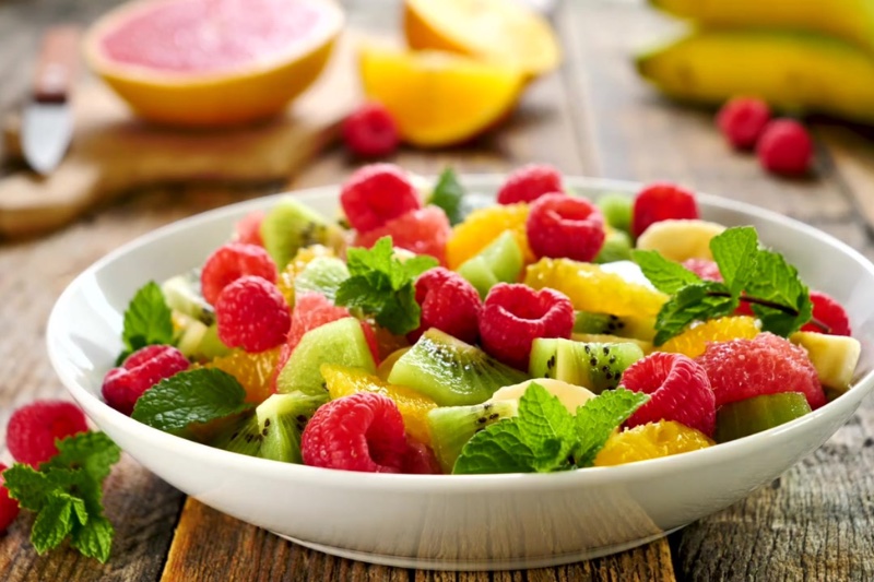 Refreshing Summer Fruit Salad in a white deep platter