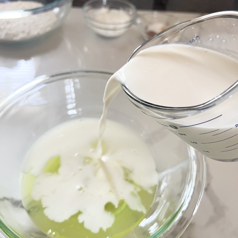 Pouring milk into the egg whites